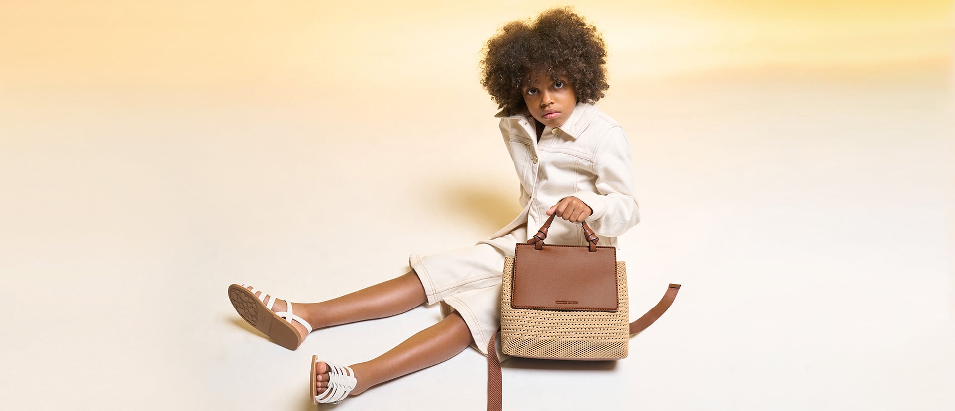 Girls’ Ida knitted front flap backpack in beige - CHARLES & KEITH