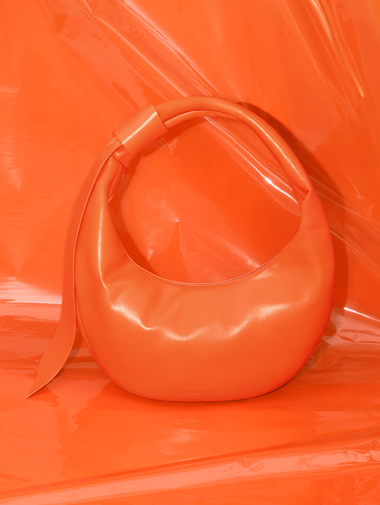 Women’s Toni knotted curved hobo bag in orange - CHARLES & KEITH