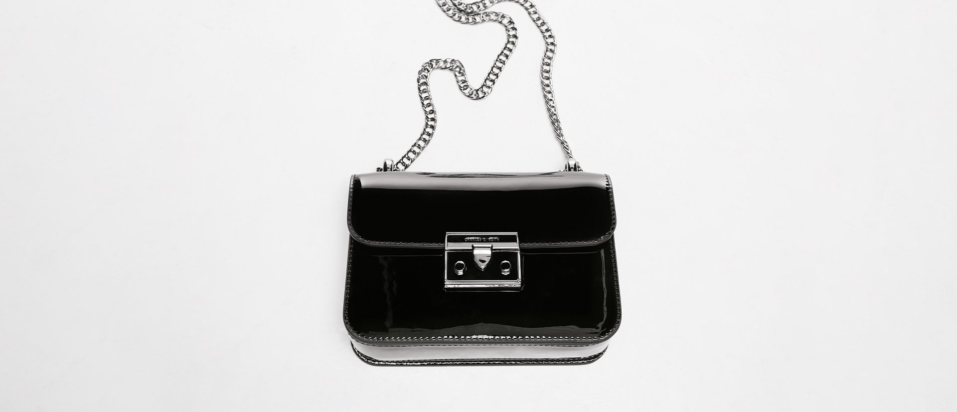Women’s Alia chain-strap patent crossbody bag in black - CHARLES & KEITH
