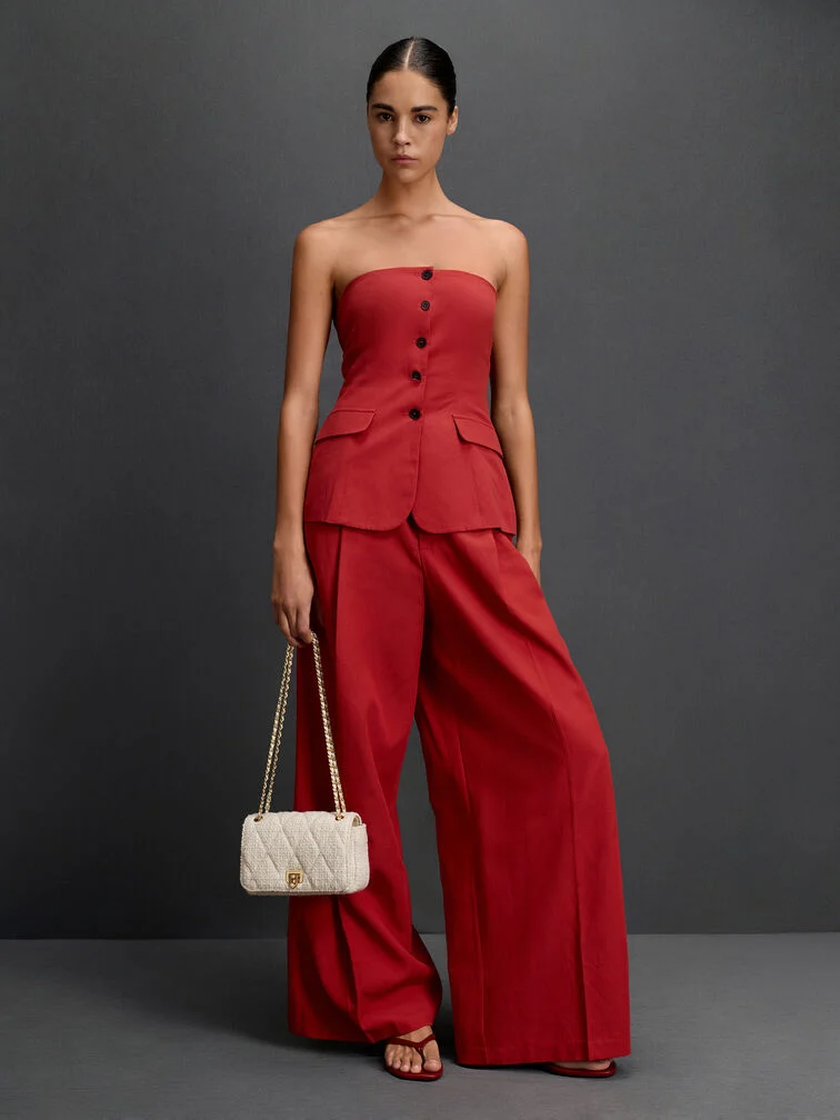 A quilted crossbody bag styled with a co-ord set for a dressy, event-ready look