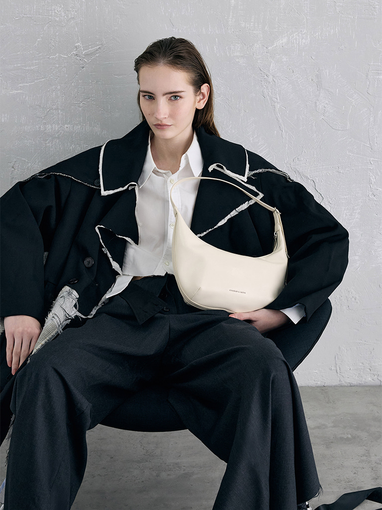 Women’s Bryna curved hobo bag in cream - CHARLES & KEITH
