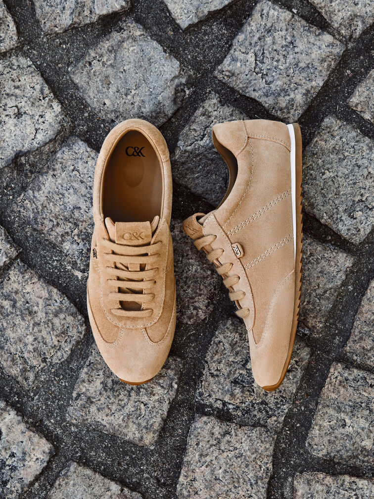 Beige Low-Top-Sneaker, ein Must-have in jeder Garderobe. 