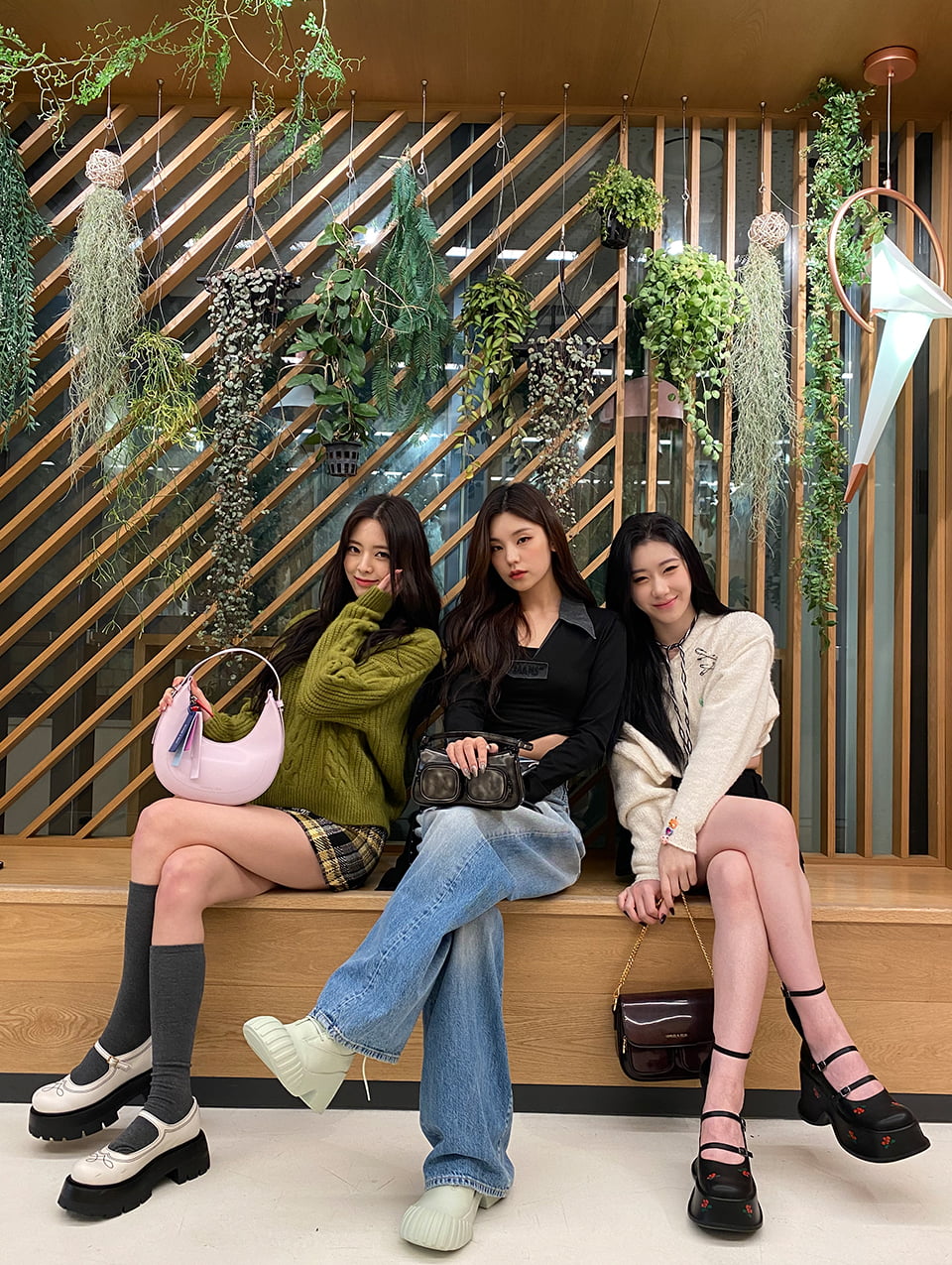 Women’s Daki Belted Fur-Trim Curved Bag in multi and Lucile Satin Platform Sandals in red, as seen on Lia; Letitia Chain-Link Shoulder Bag in light blue and Harrianna Thigh-High Boots in black, as seen on Ryujin - CHARLES & KEITH