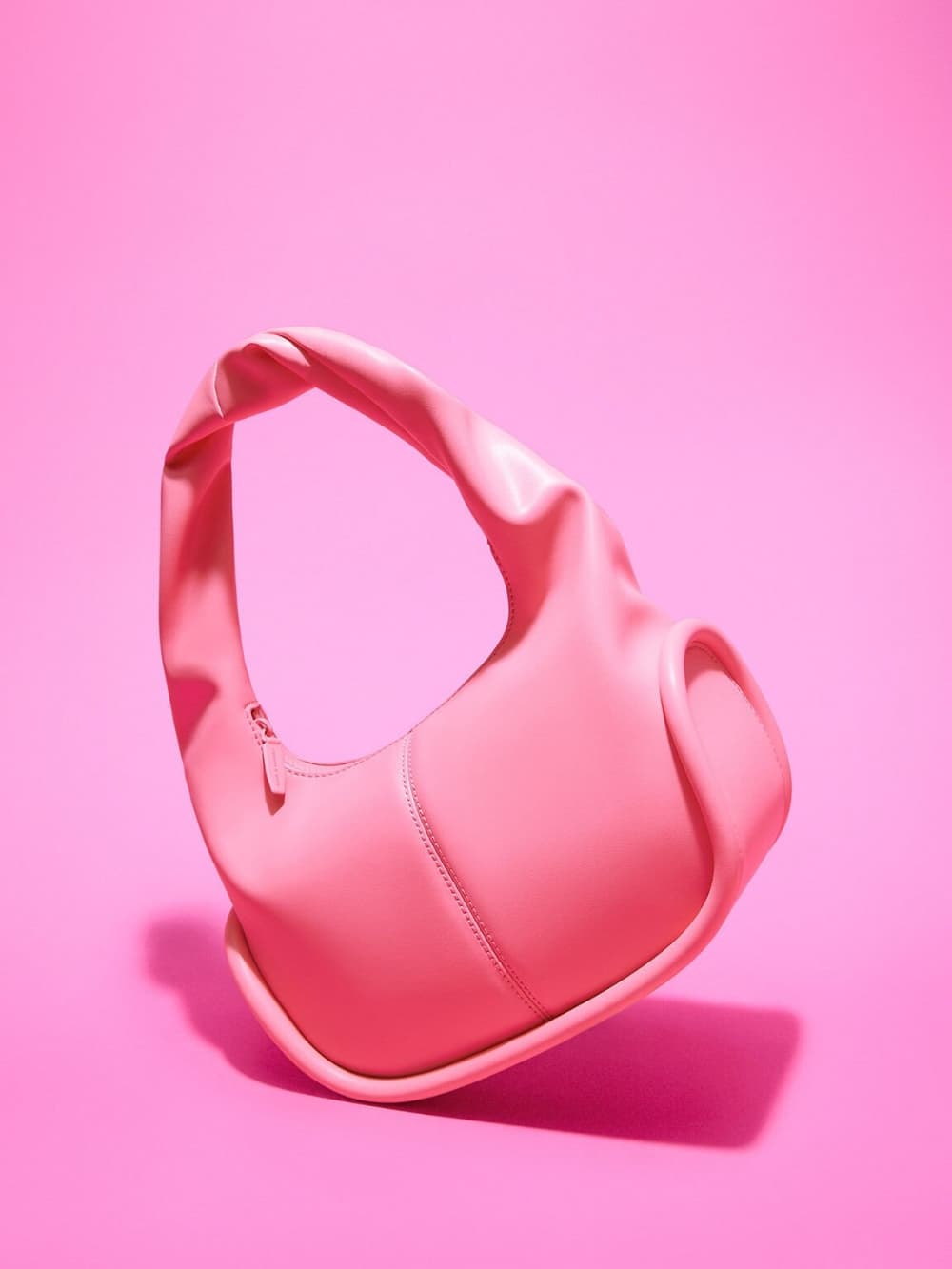 Women’s pink Tubular slouchy hobo bag, pink micro Koa square push-lock bag and pink Koa square push-lock shoulder bag - CHARLES & KEITH