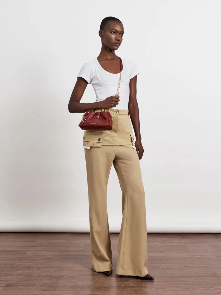 A slouchy crossbody bag styled with a casual, everyday outfit