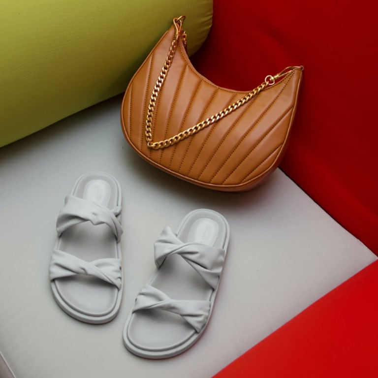 Women’s twist strap padded slide sandals and chain handle pleated moon bag, as seen on Marie Wibe Jedig – CHARLES & KEITH