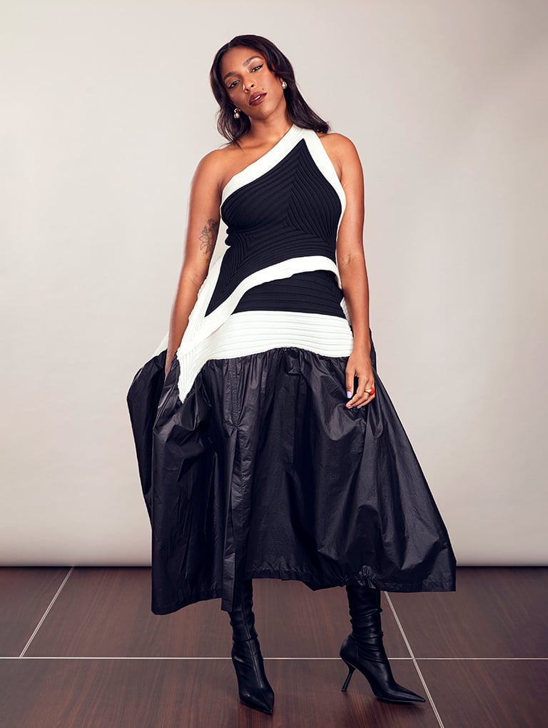 Women’s slant-heel knee-high boots in black, as seen on Jessica Williams - CHARLES & KEITH