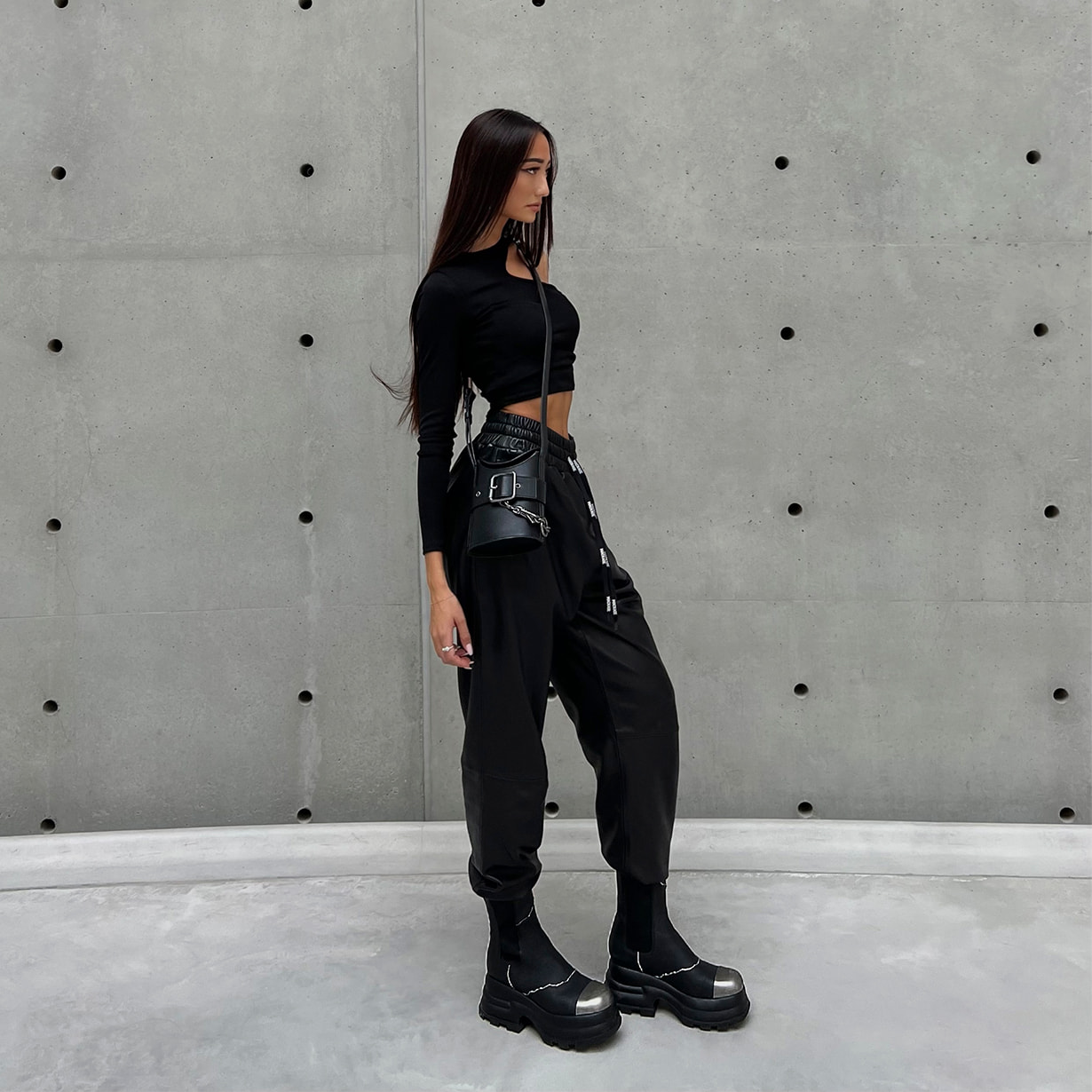 Women’s Jules Leather Chelsea Boots and Jules Leather Belted Bucket Bag, both in black  – CHARLES & KEITH