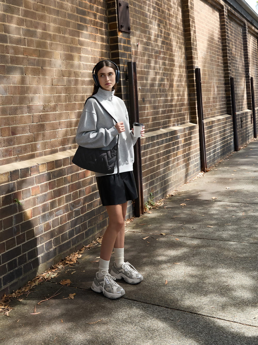 Women’s nylon chevron shoulder bag in jet black and metallic mesh contrast-trim chunky sneakers in silver - CHARLES & KEITH