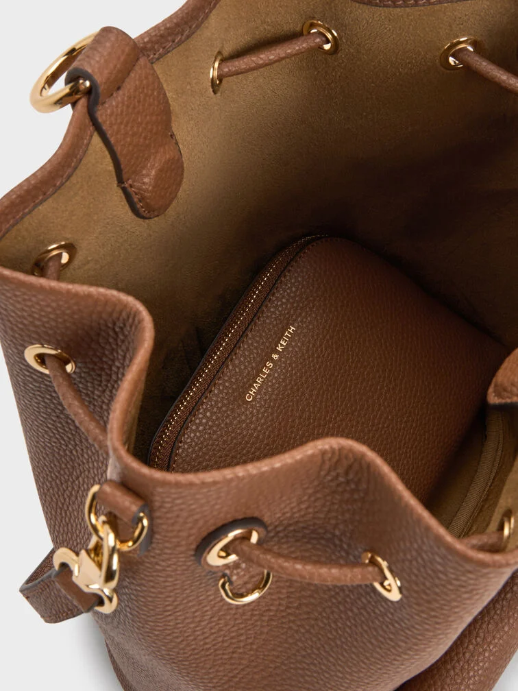 The Beryl backpack features a drawstring closure, a main compartment and a small pouch.