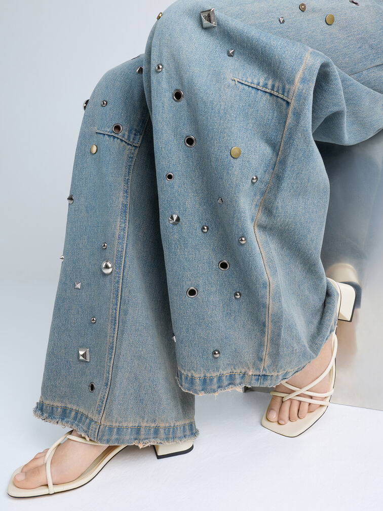 White shoes complement light-wash denim. 