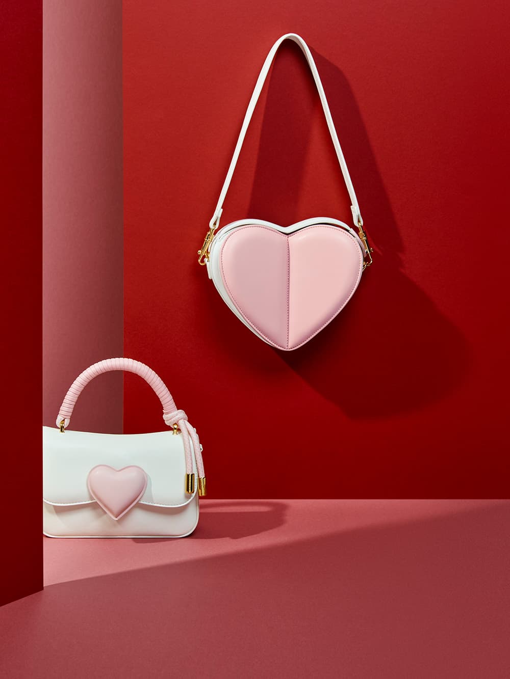 Women's white heart sling bag and white heart-motif coiled top handle bag - CHARLES & KEITH