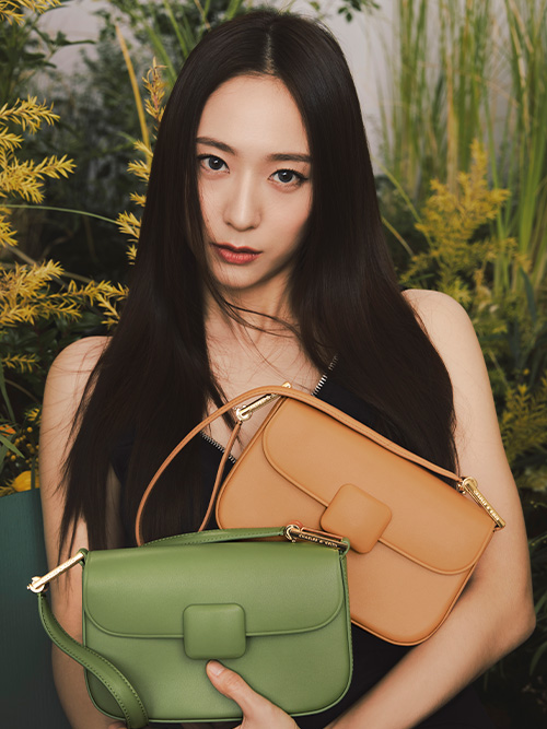 Global brand ambassador Krystal Jung sports our green and orange Koa square push-lock shoulder bag
