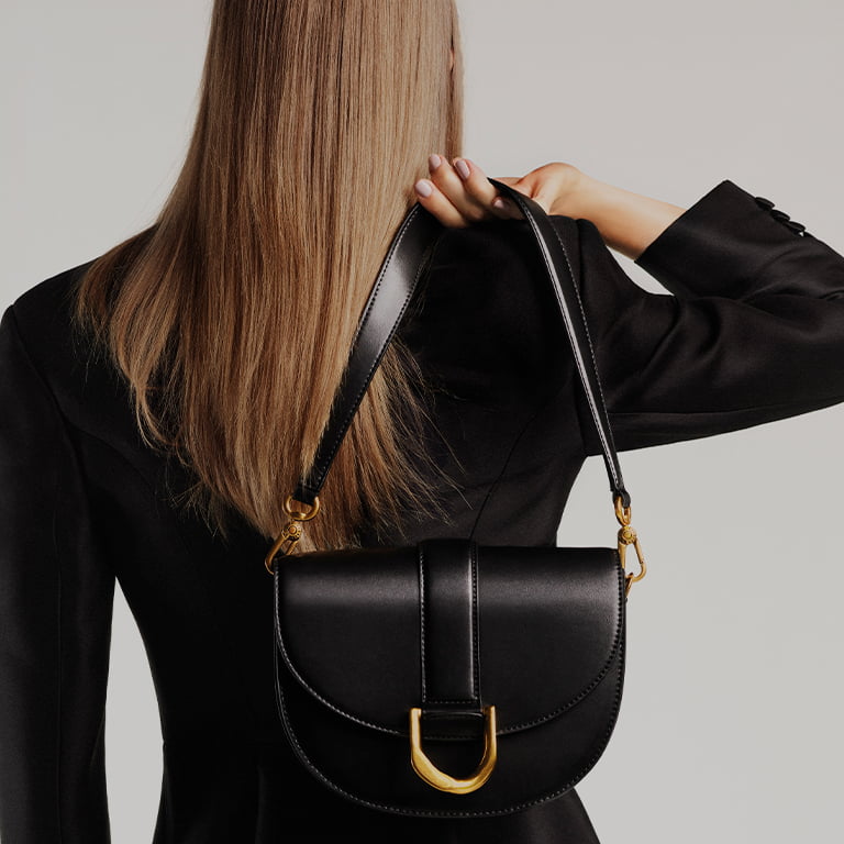 Women’s metallic buckle saddle bag in black (close up) – CHARLES & KEITH