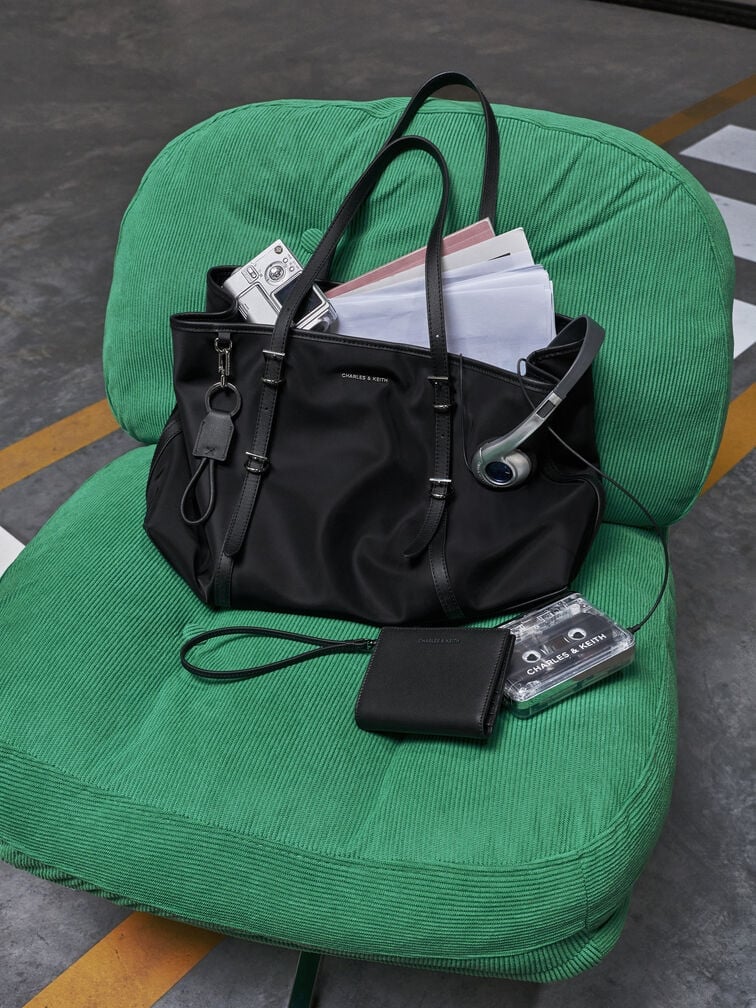The Levy tote packed to the brim with reading materials and other items typically carried by a uni student.