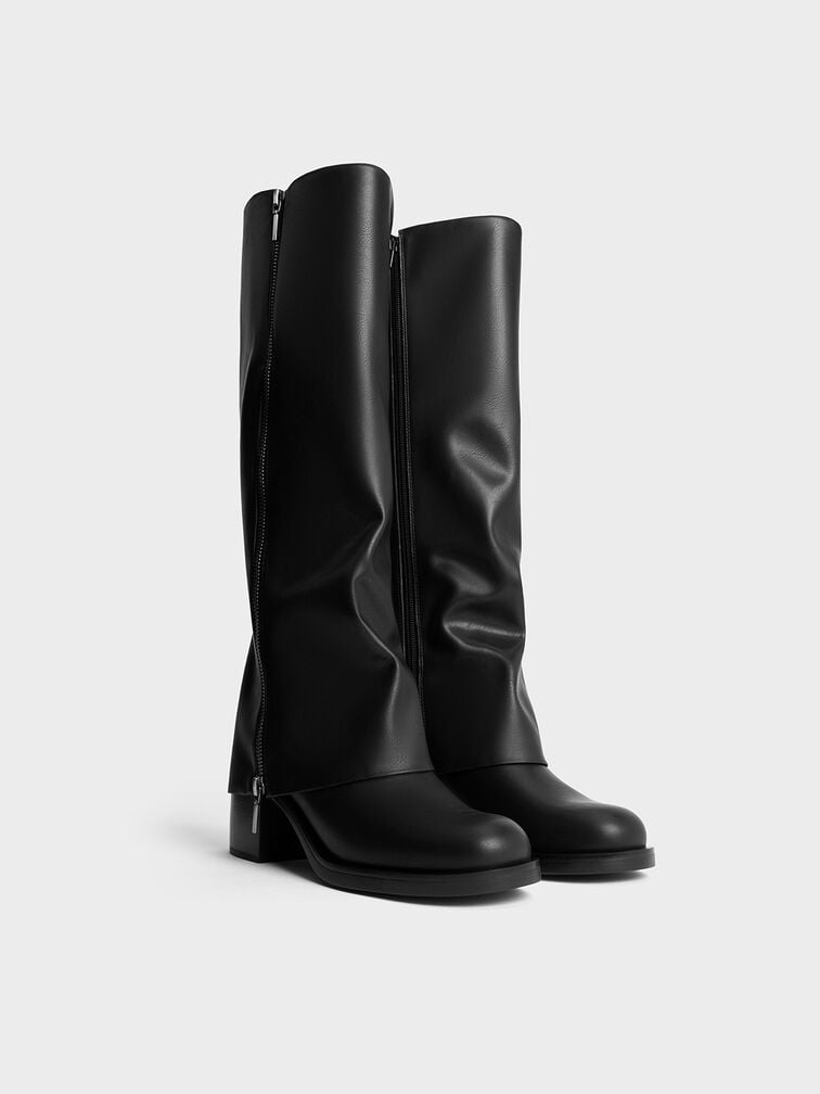 Black boots are perfect for creating high contrast with a winter white outfit.