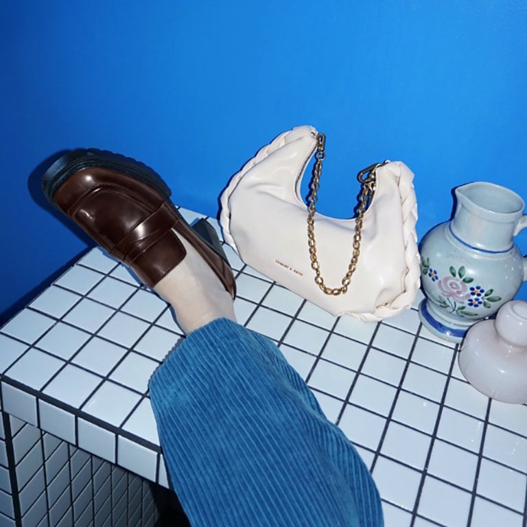 Women’s chain handle braided hobo bag in cream and penny loafer pumps, as seen on Anne Johannsen - CHARLES & KEITH